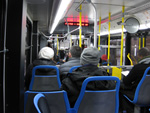 The interior of bus #4015 while working route #147 Outer Drive Express on December 13, 2008. Ad placards inside boasted about the features of the new hybrid buses. (Photo by Kevin Zolkiewicz)
