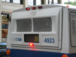 Bus #4923 at Jackson and Michigan working route #X28 Stony Island Express on June 10, 2005. The original Pace bus number (2119) is still visible.