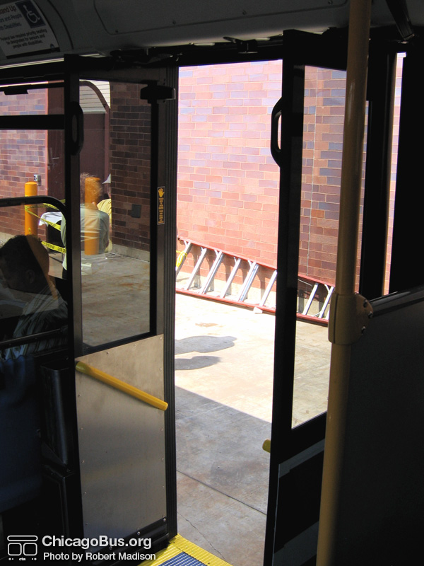Click to advance to next image. The rear doors of prototype bus #500 while at Skokie Shops on June 17, 2006. Like the 1000-series New Flyers, the rear doors make use of motion sensors, however they open inward instead of outward. (Photo by Robert Madison)