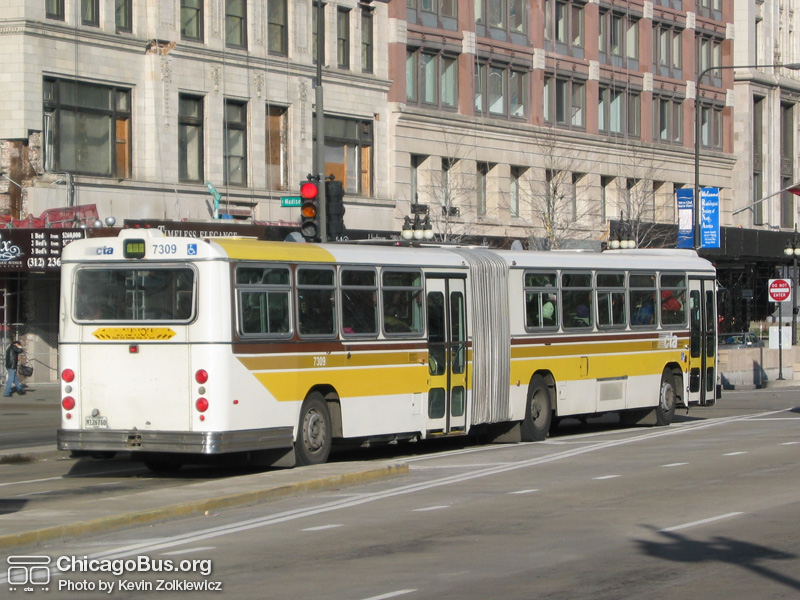 Bus #7309 at Michigan and Madison working route #14 Jeffery Express on November 26, 2003. (Photo by Kevin Zolkiewicz)