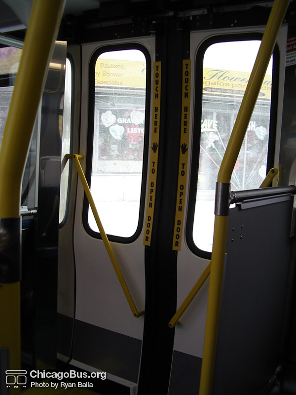 The interior of prototype bus #7800 on January 22, 2005. Instead of a push bar, the rear doors opened through the use of motion sensors. (Photo by Ryan Balla)