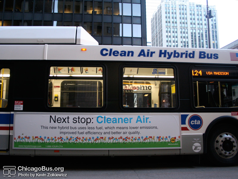 Bus #809 at South Water and Michigan working route #124 Navy Pier on March 10, 2007. The lettering "Clean Air Hybrid Bus" and an accompanying advertisement inform the public that this is a special bus. (Photo by Kevin Zolkiewicz)