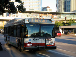 Hybrid bus #901 at Roosevelt and State working route #12 Roosevelt on August 31, 2007. The roof-mounted battery pack is a bit slimmer than the 800-series hybrids.