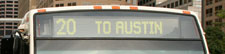 Phot of an LED-backlit flip-dot desgination design on a CTA bus reading '20 TO AUSTIN'